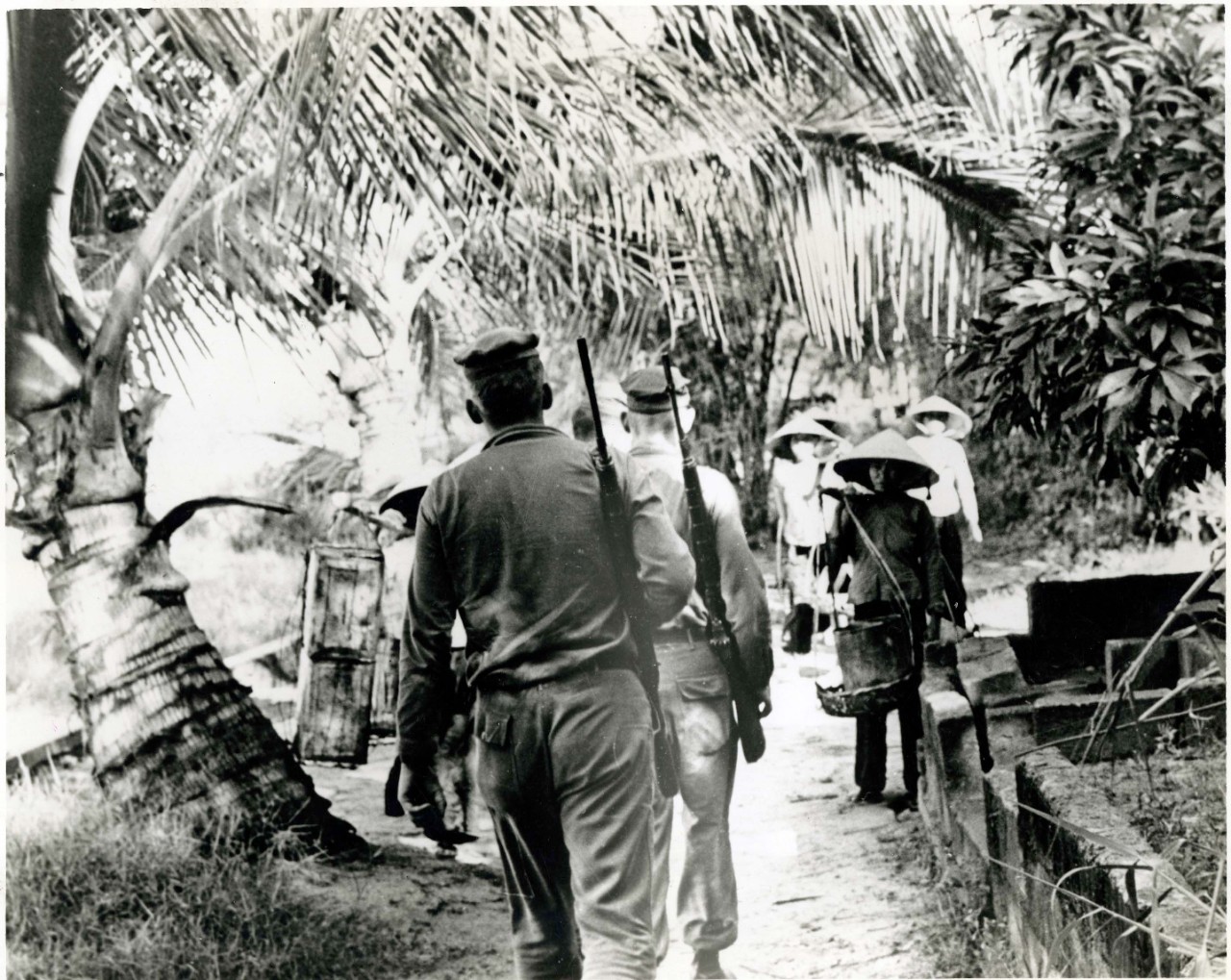 Seabee's from Naval Mobile Construction Battalion (NMCB) 11's Provisional Platoon greeting villages on patrol in the village of My Thi, Vietnam.