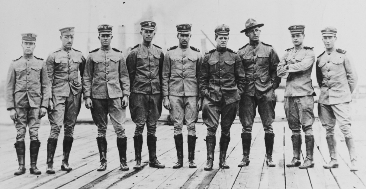 Photo of nine officers in uniform in a line.