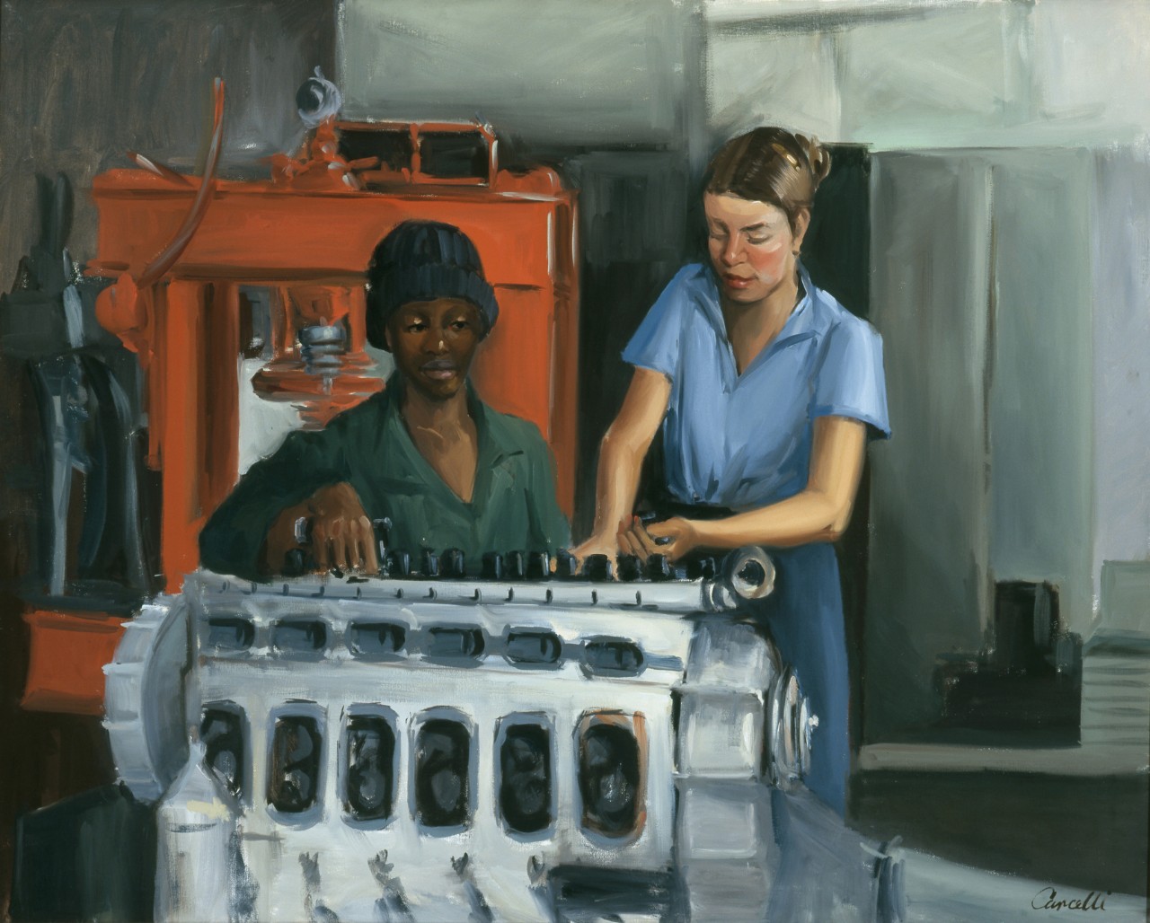 Two women stand in front of a small engine