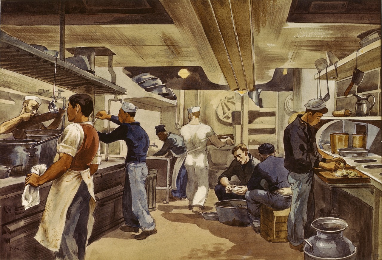 Sailors in a ships kitchen working to prepare a meal