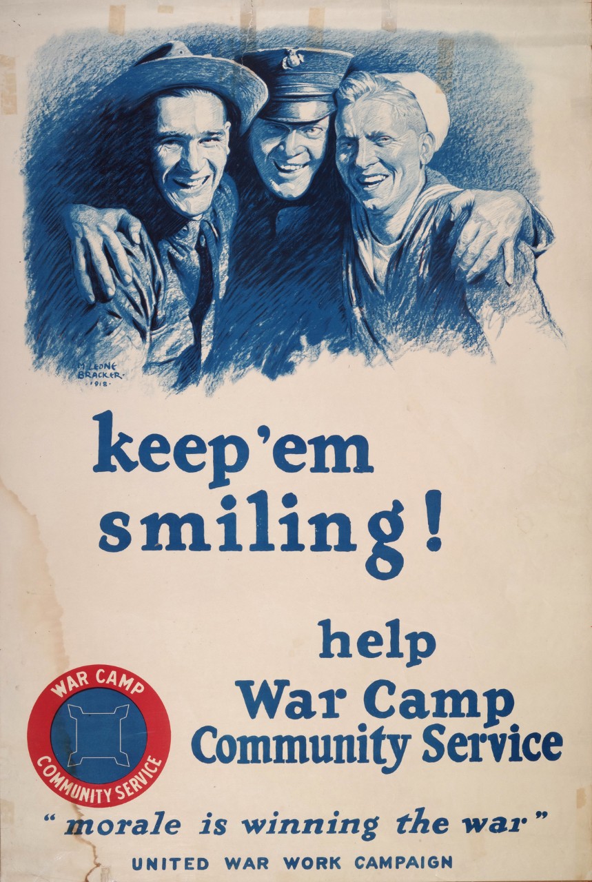 A civilian, a soldier and sailors with linked arms smiling