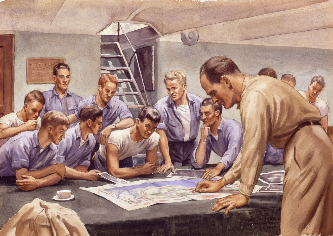 Officer briefing sailors on invasion