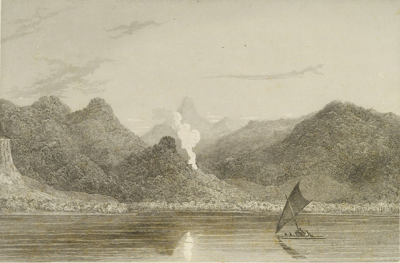 A canoe is in a lagoon with jungle covered mountains in the background