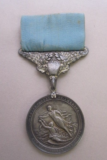 Version 2 silver lifesaving medal with blue ribbon given to lt nimitz for saving another sailor