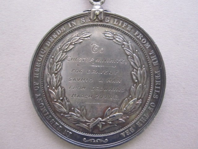 Version 2 silver lifesaving medal with blue ribbon given to lt nimitz for saving another sailor engraving