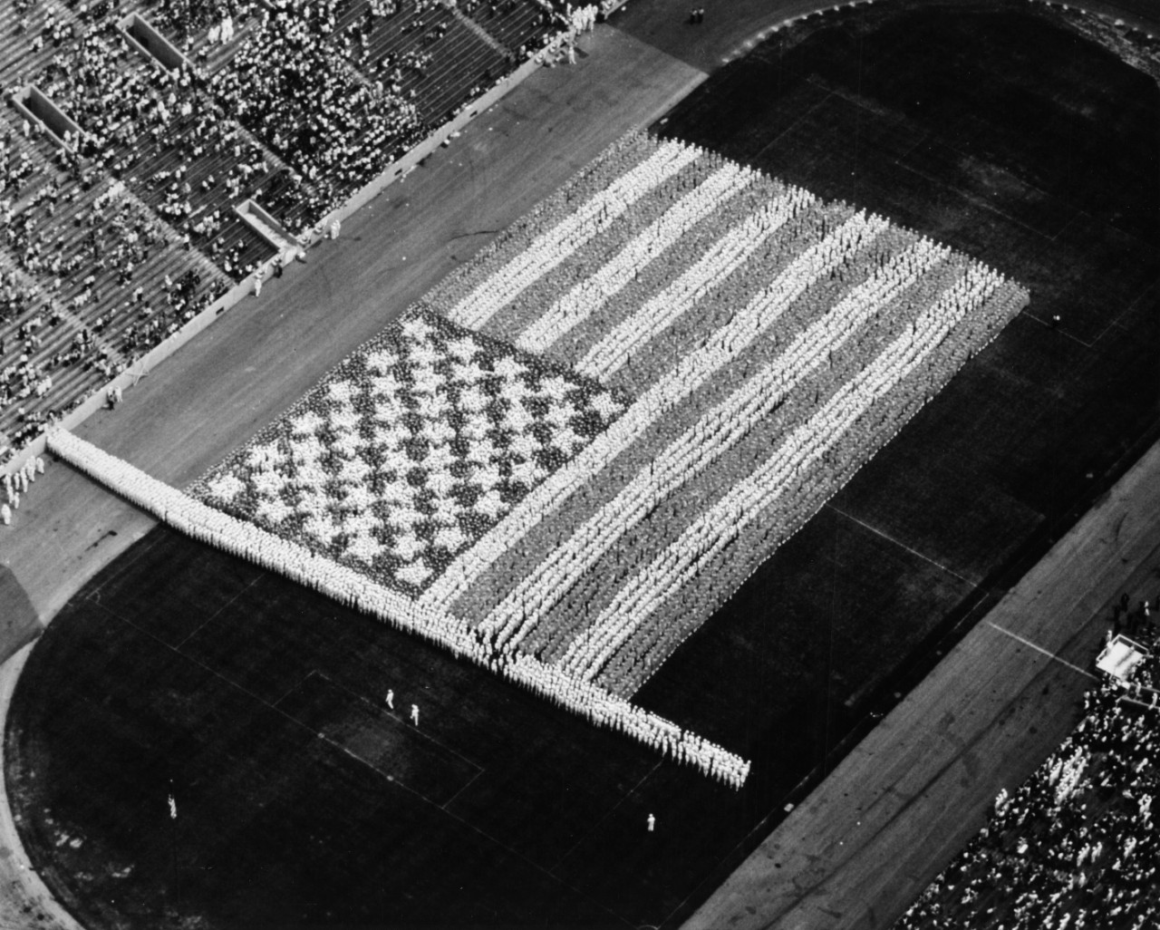 10,000 sailors from the Great Lakes Naval Training Center form a living flag at Soldier Field, Chicago.