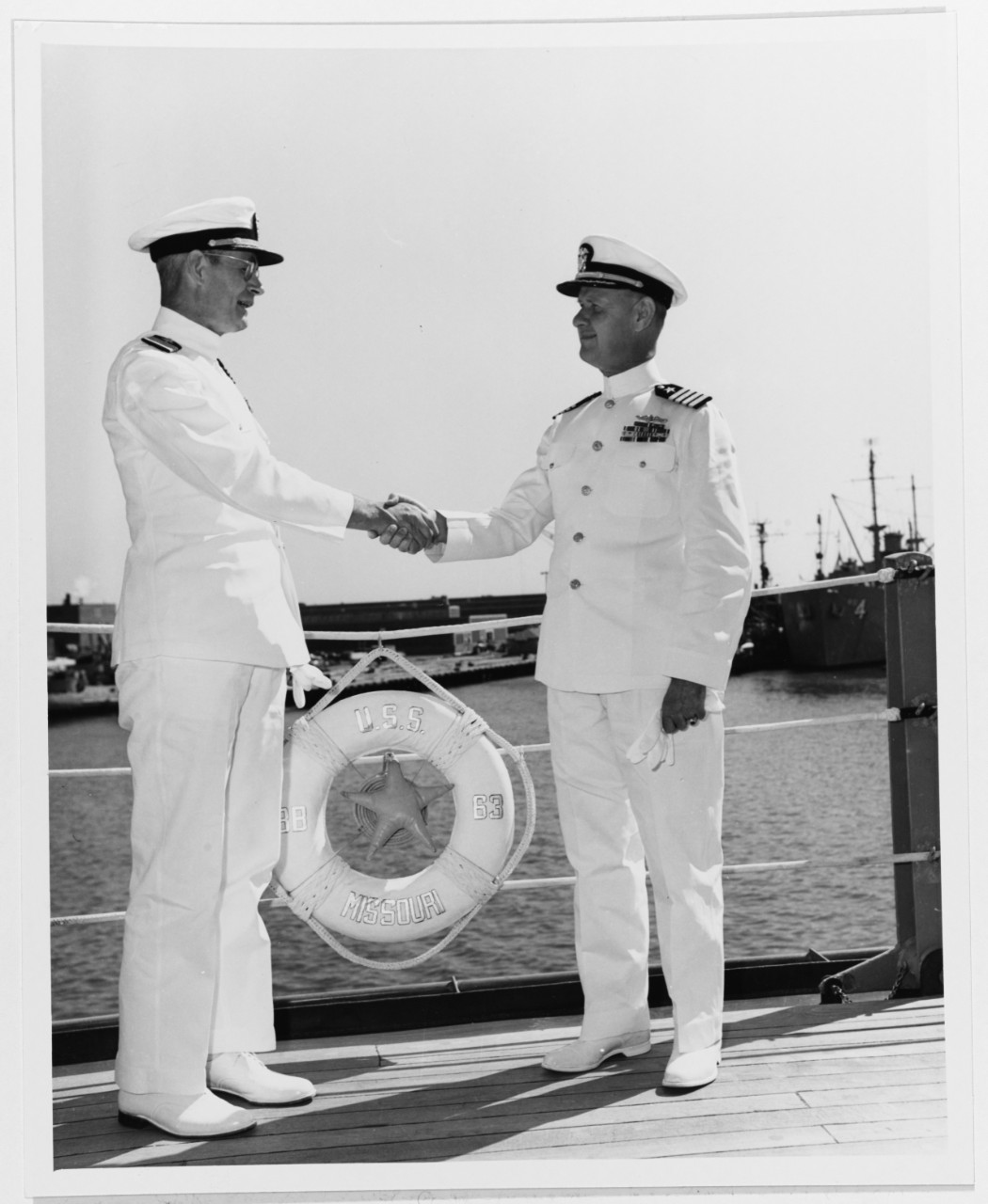 Photo #: 80-G-641308  Captain John Sylvester, USN Captain Warner R. Edsall, USN