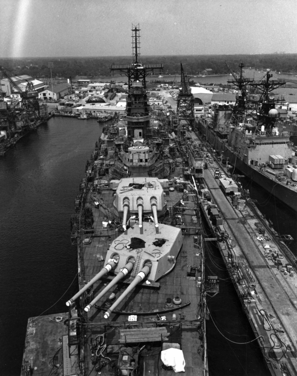 High angle view of the battleship Iowa (BB-61) in port at Pascagoula, Mississippi, for conversion and repair prior to being recommissioned.