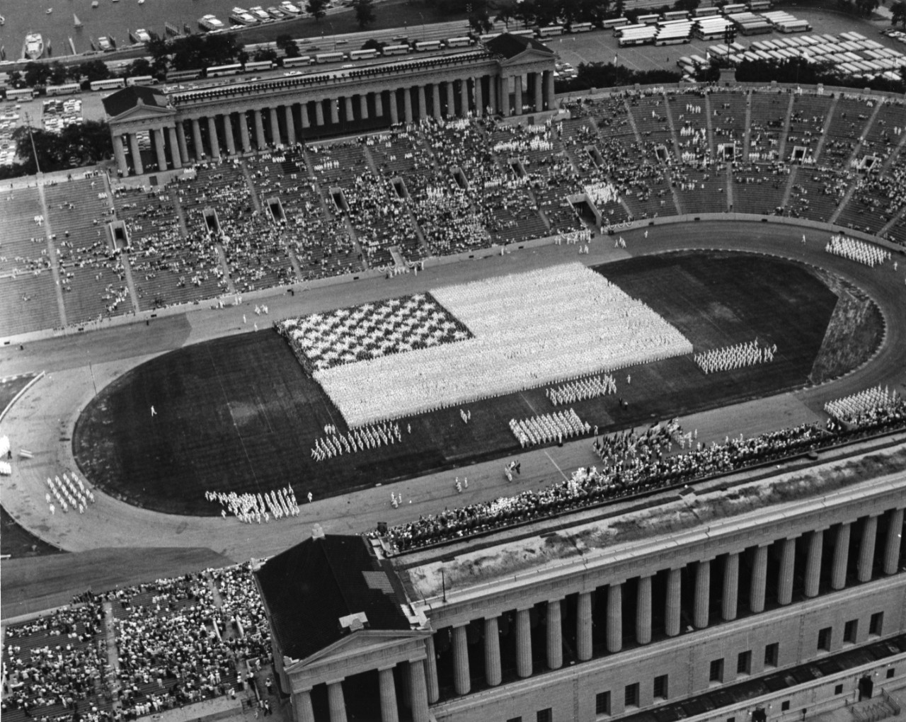 10,000 sailors from the Great Lakes Naval Training Center form a living flag at Soldier Field, Chicago.
