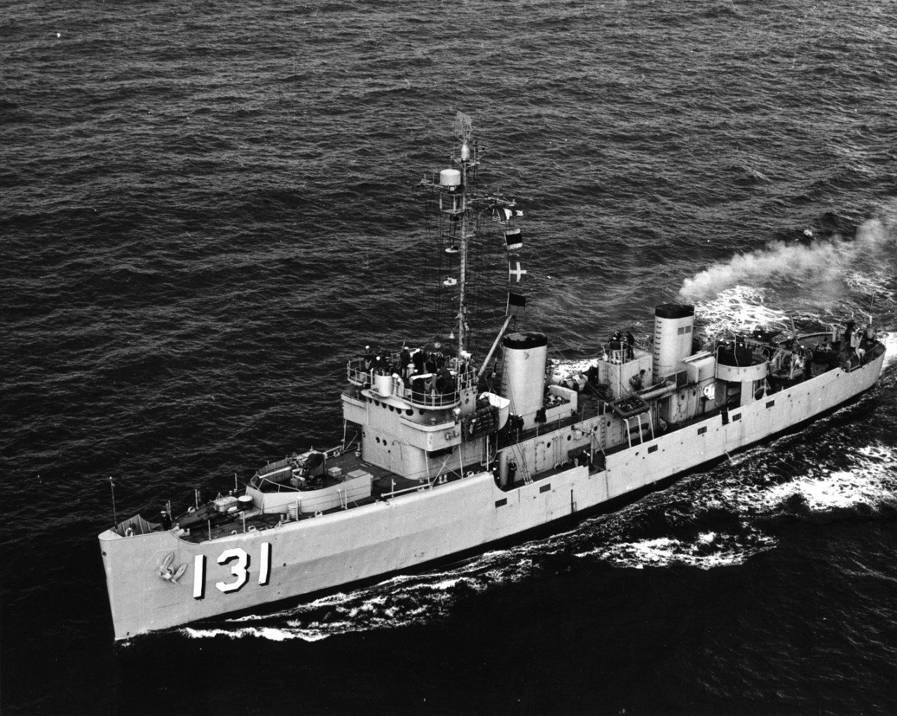Port quarter aerial view of minesweeper USS Zeal (AM-131) underway, circa early 1950s