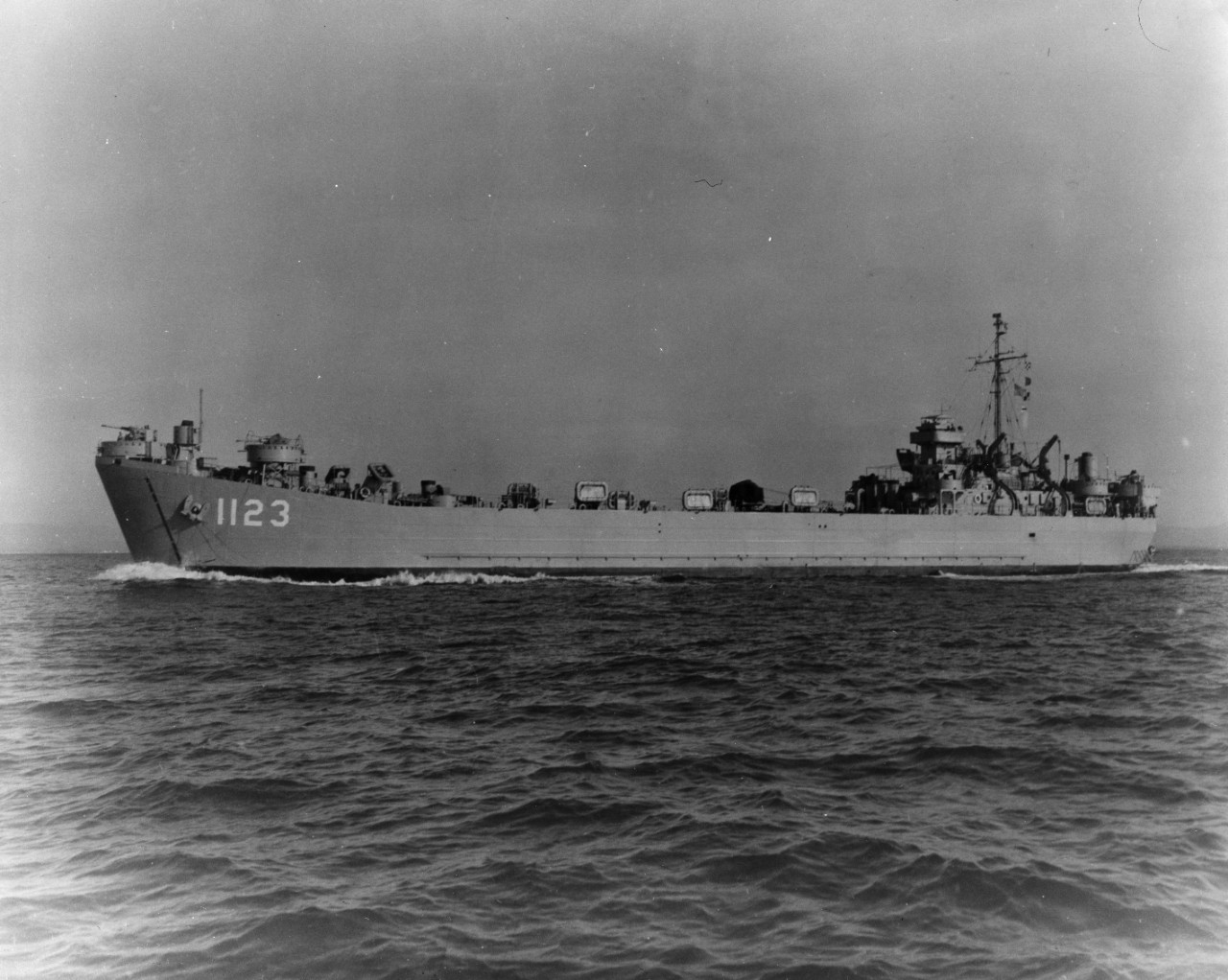 Port broadside view of tank landing ship USS Sedgwick County (LST-1123) underway