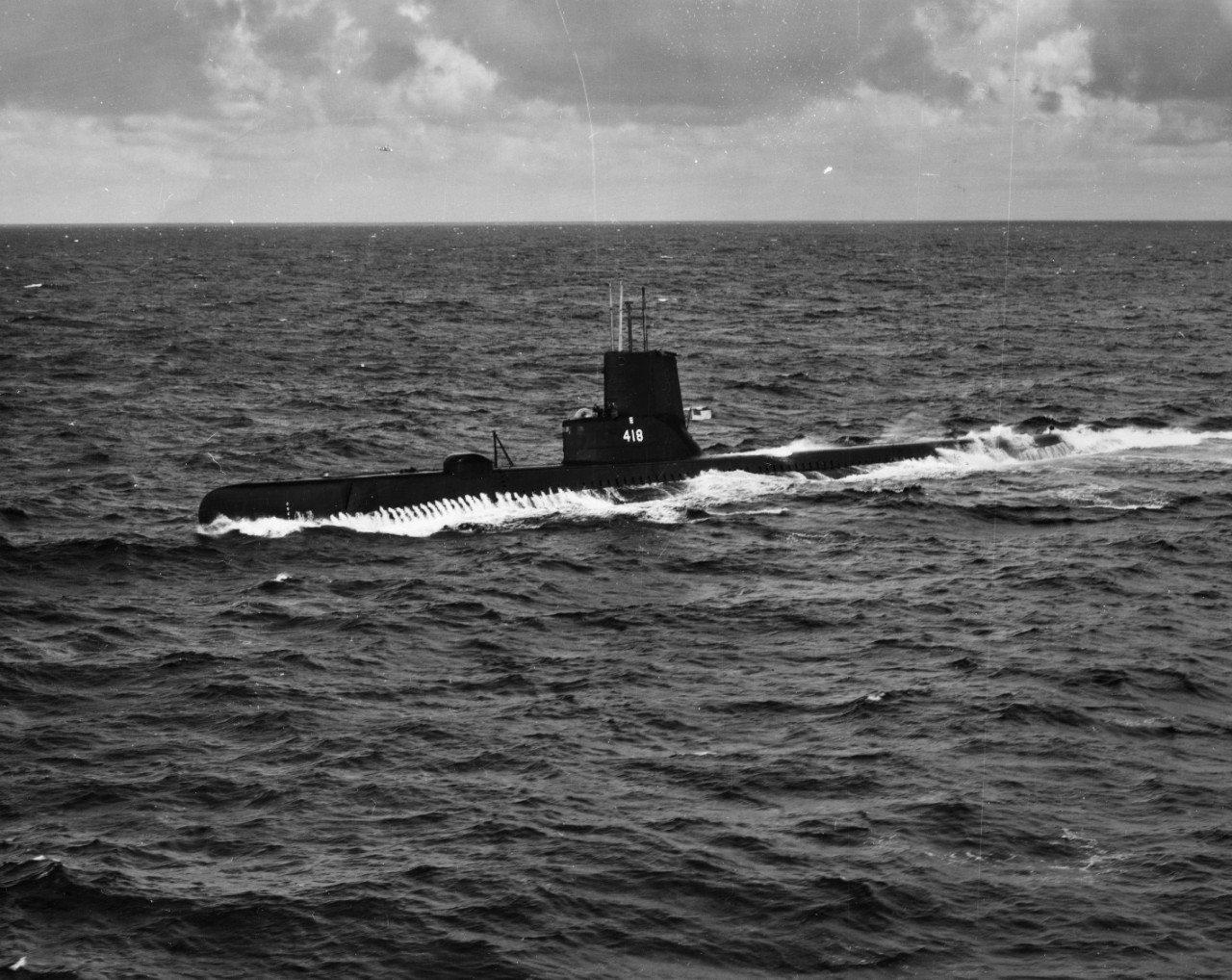Aerial view of submarine USS Thornback (SS-418) underway on the surface