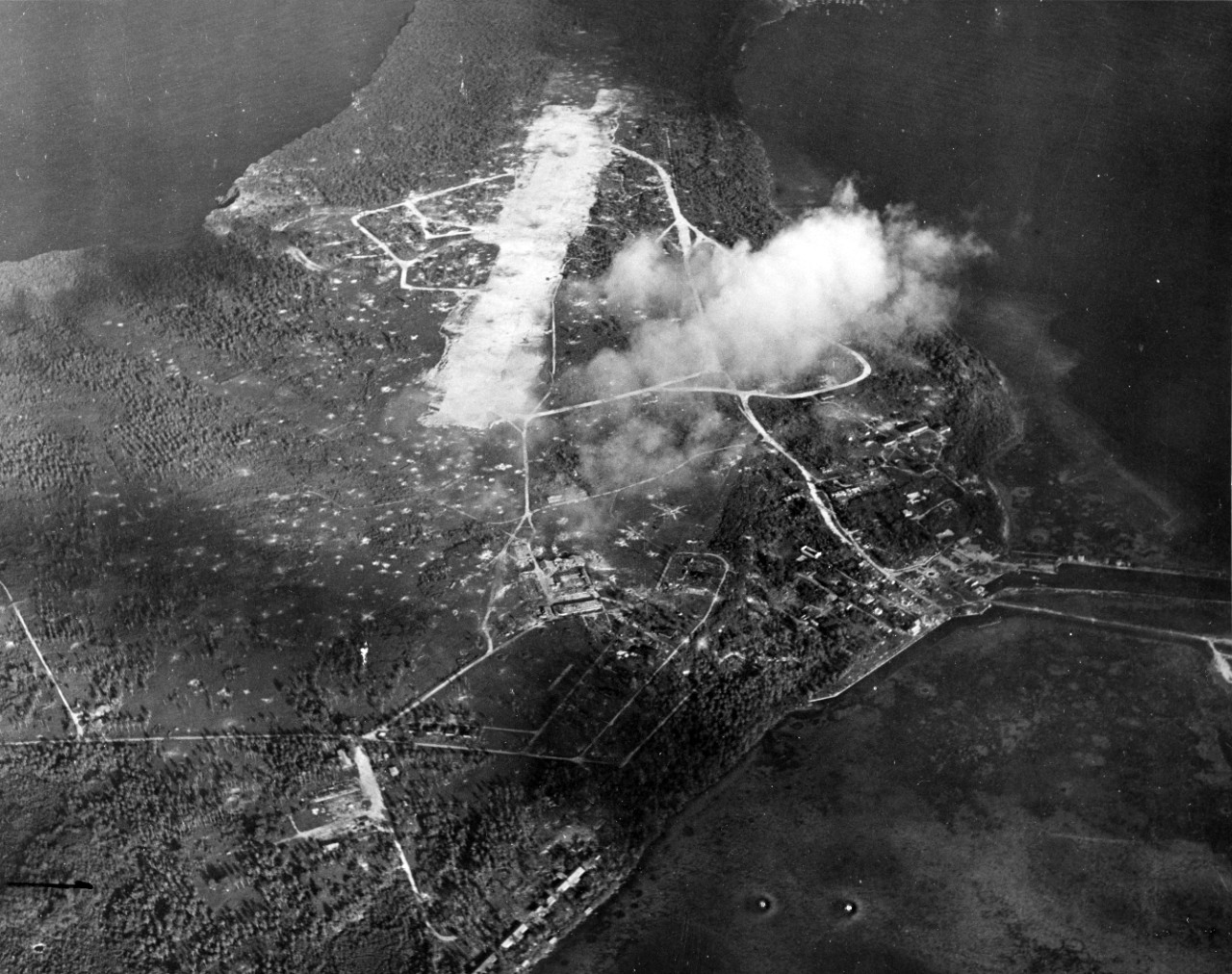 View of Sumay Town and Orote Airfield, Guam, following pre-invasion bombardment, July 20, 1944.