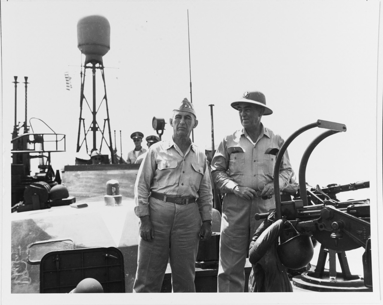 Vice Admiral Thomas C. Kinkaid, USN, Commander Seventh Fleet, and Lieutenant General Walter Krueger, USA Commander Sixth Army, on board PT-525, off Leyte Island, the Philippines, 23 October 1944. The boat was taking General MacArthur ashore at the time.
