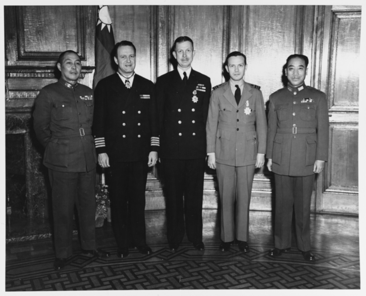 General Chien Ta-Chun, mayor of Shanghai, Captain Irwin F. Beyerly, Lieutenant Commander Daniel Heagy (HC), Lieutenant Commander Joseph E. Champe, and General C.S. Lee