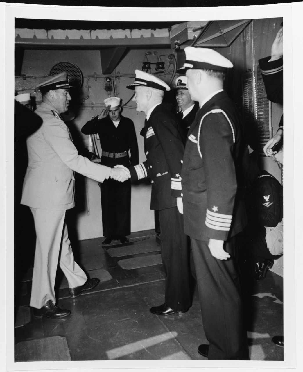 Rear Admiral Francis X. McInerney greets Rear Admiral Lyman A. Thackery