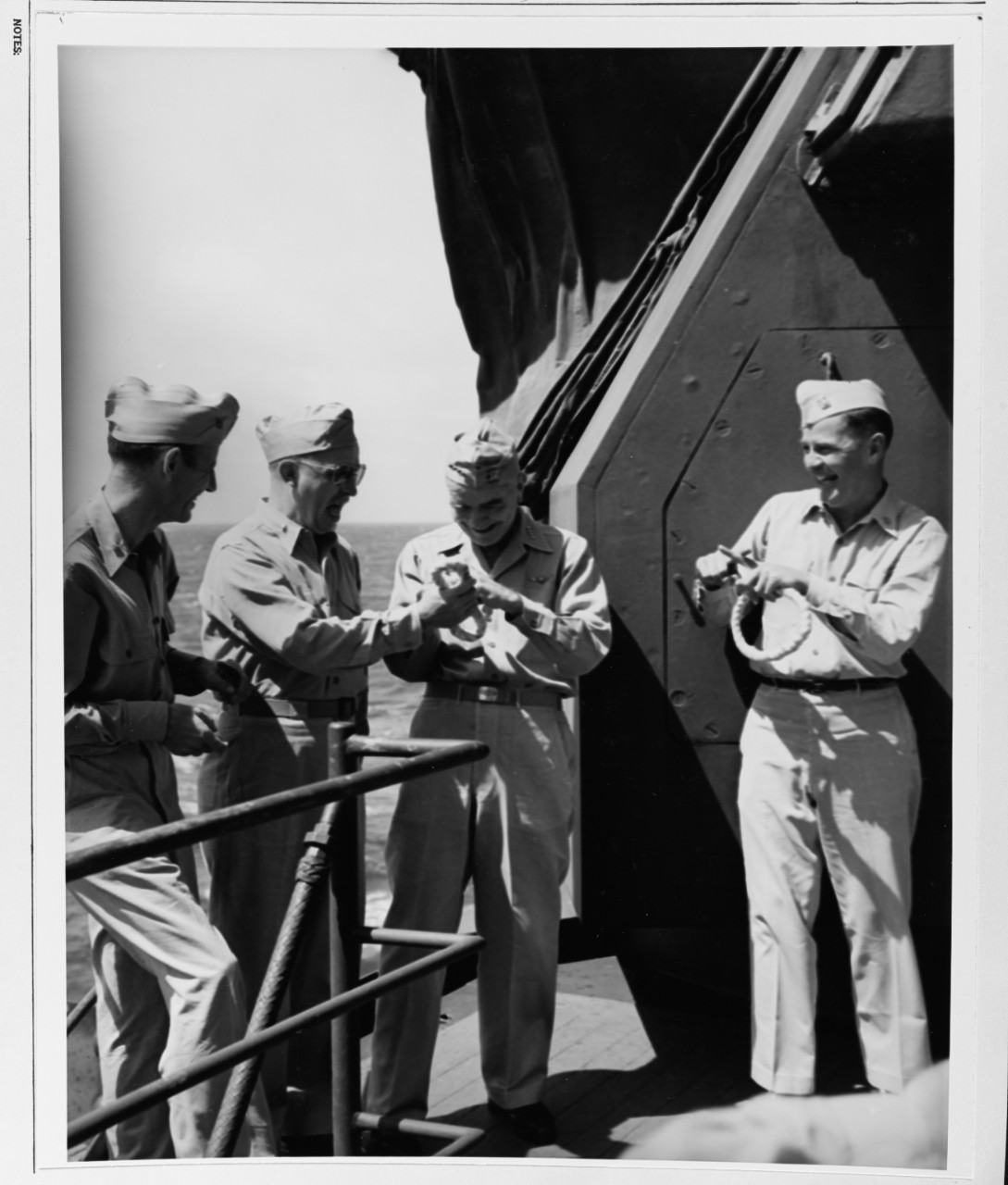 Admiral William F. Halsey, Commander Third Fleet, takes some good natured kidding from his officers aboard USS NEW JERSEY (BB-62)