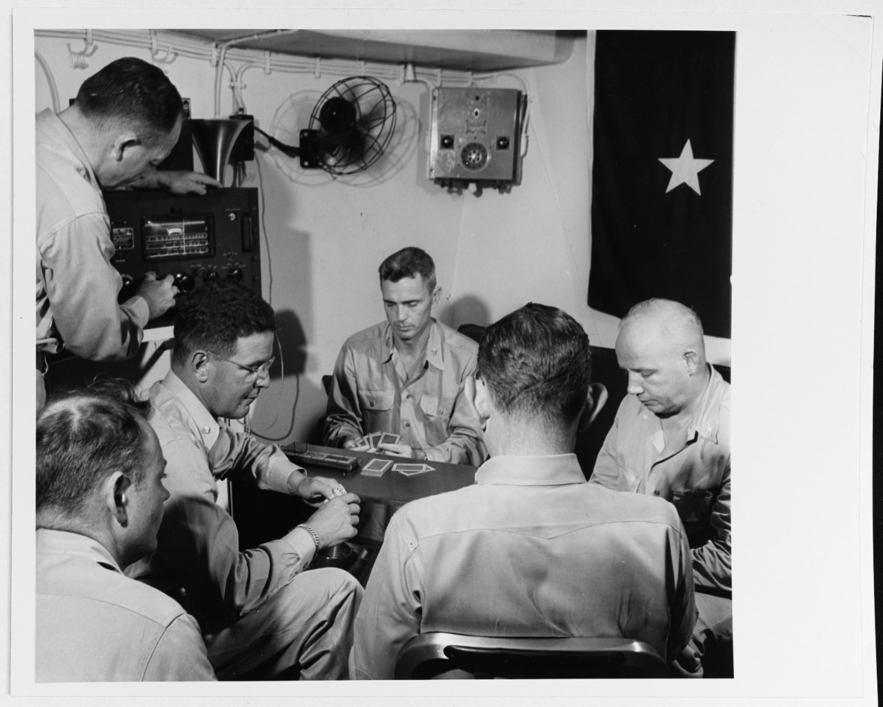 Members of Admiral William F. Halsey's staff enjoy a game of cribbage