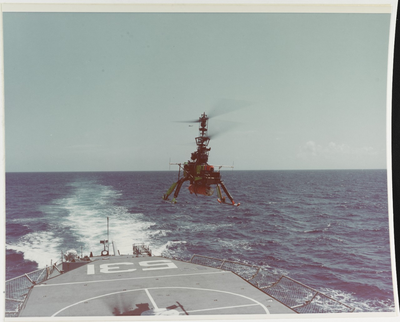 "DASH" (Drone Anti-Submarine Helicopter) in free flight over USS HAZELWOOD (DD-531)