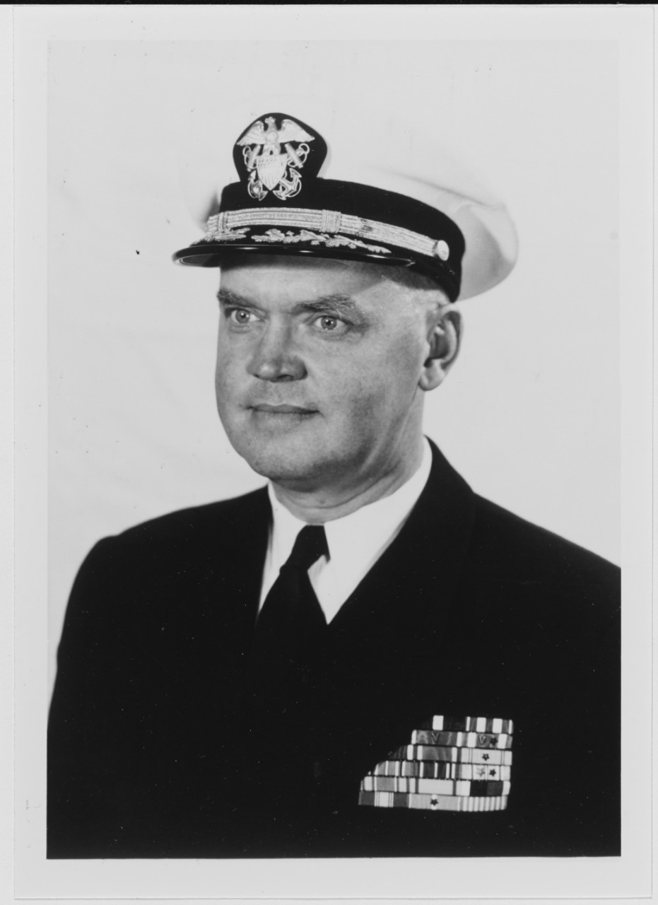 Captain James R. Hansen, USN.