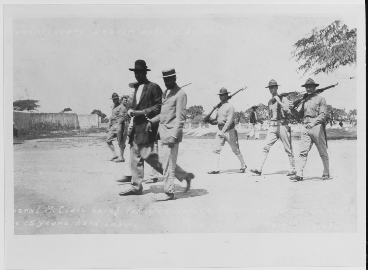 Port Au Prince, Haiti. Revolutionary Leader, General M. Codio, being taken to prison by U.S. Marine Guards, March 1916