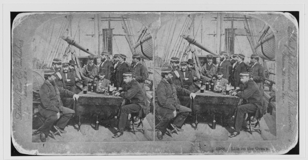 "Life on the Ocean". Officers and passengers of a Merchant Steamship pose on deck, with table and wine bottles, circa the 1870s or 1880s