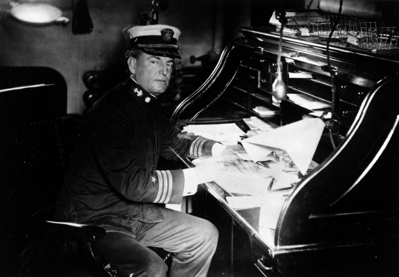 CDR William A. Moffett in his cabin onboard ship. Photo taken by A.E. Thorpe of the Philadelphia "Evening Times". The ship is possibly USS Chester (CS-1), which Moffett commanded in 1914. 