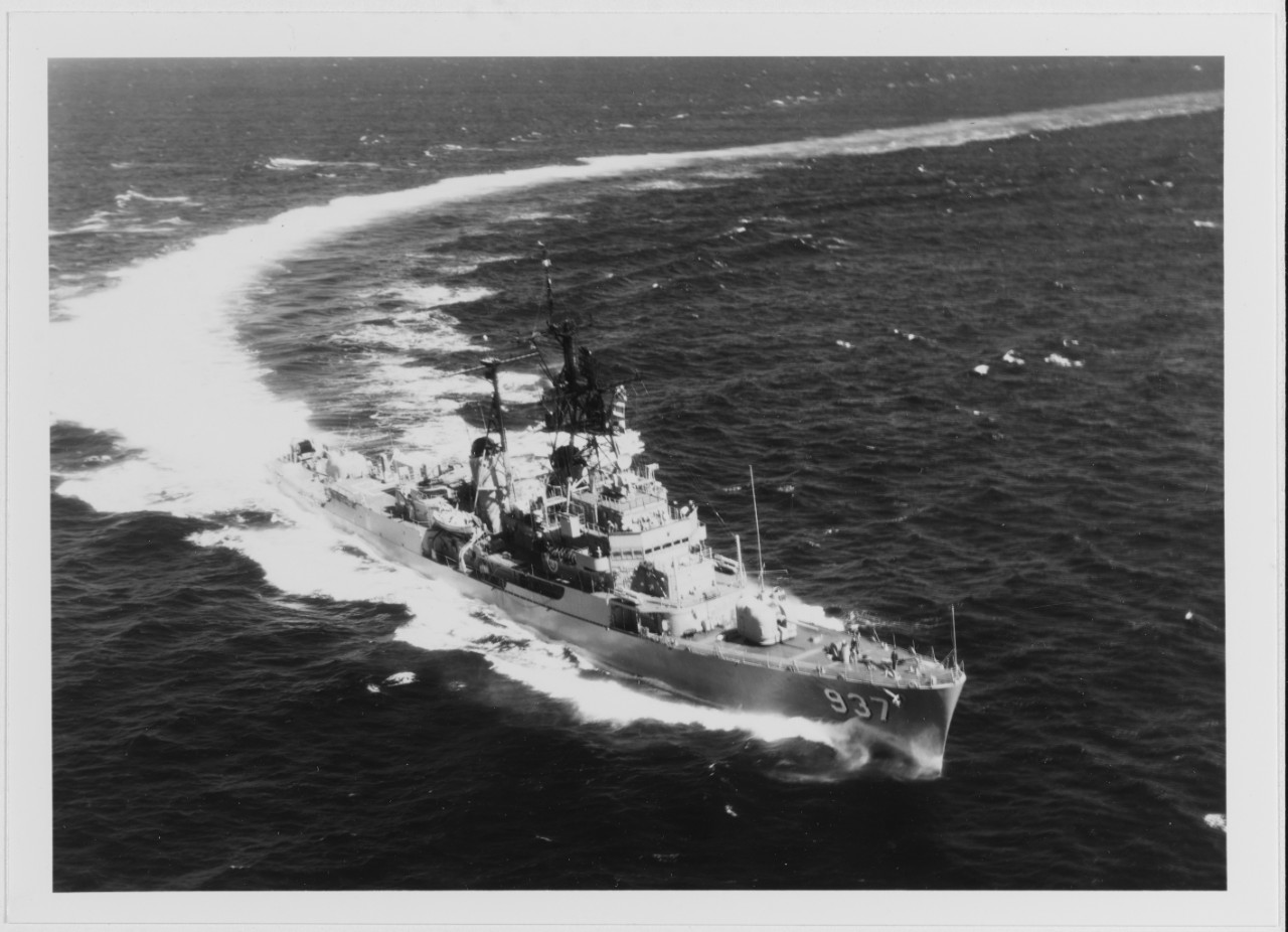 USS DAVIS (DD-937) makes a high-speed turn to port, while operating at sea during the 1970s