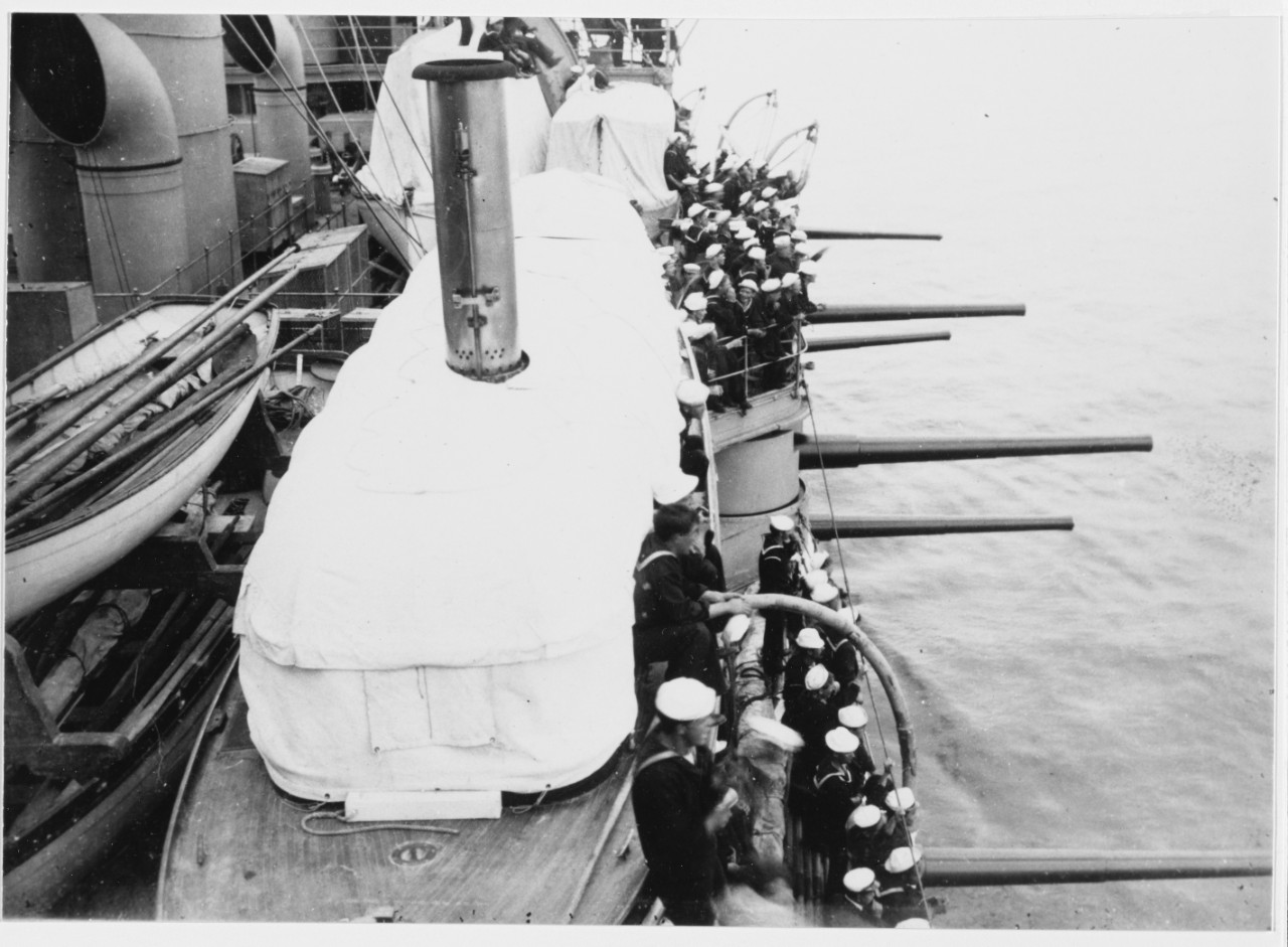 USS MAINE (BB-10) Broadside battery 6"/50 guns trained out, as crewmen watch, circa 1904.
