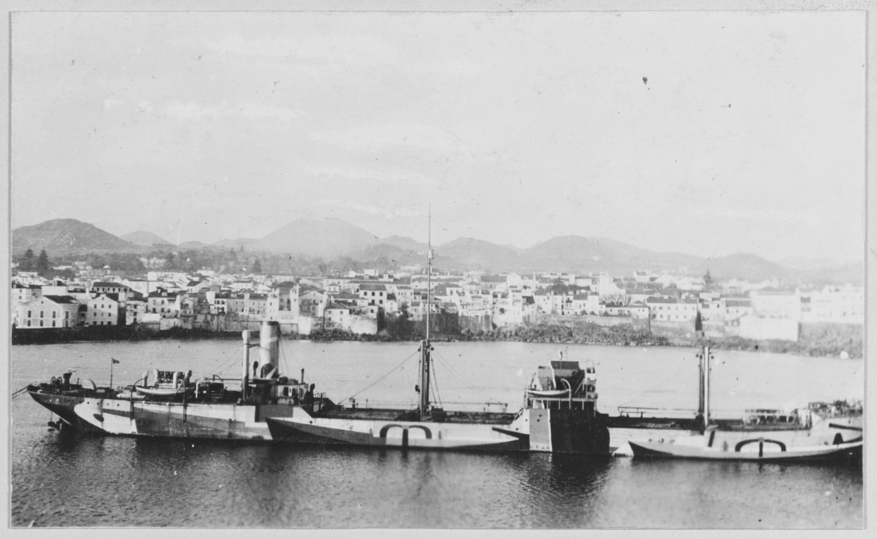 Italian ships with camouflage. City in background