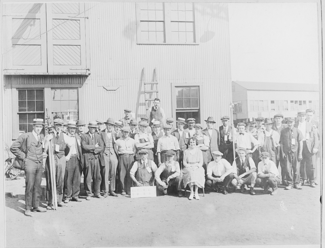 Group of Employees, including one woman, seated. Lake Torpedo Boat Company, Bridgeport, Connecticut