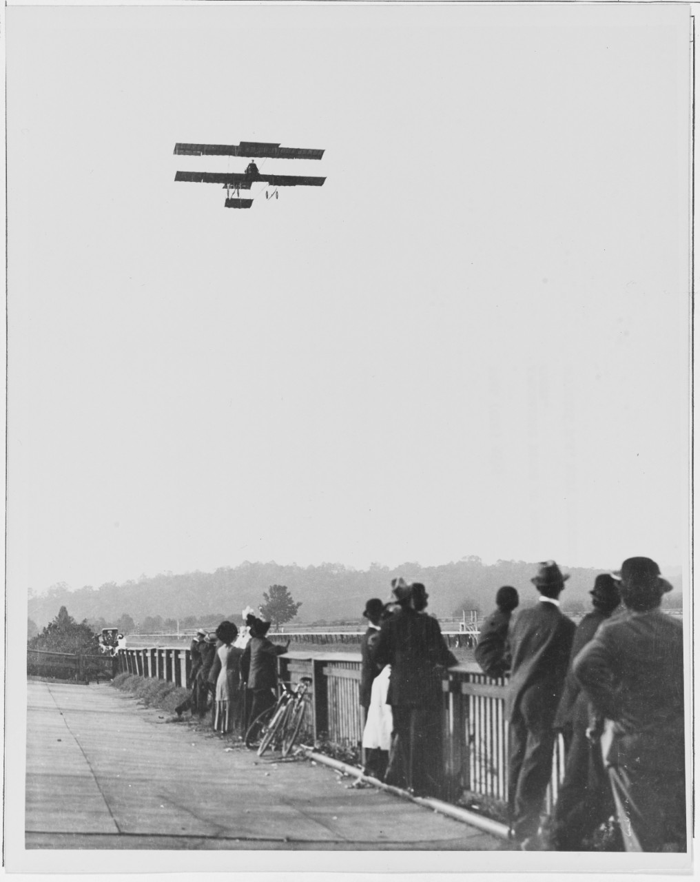 Spectators watch French Farman Biplane being flown, Washington, D.C., 1910