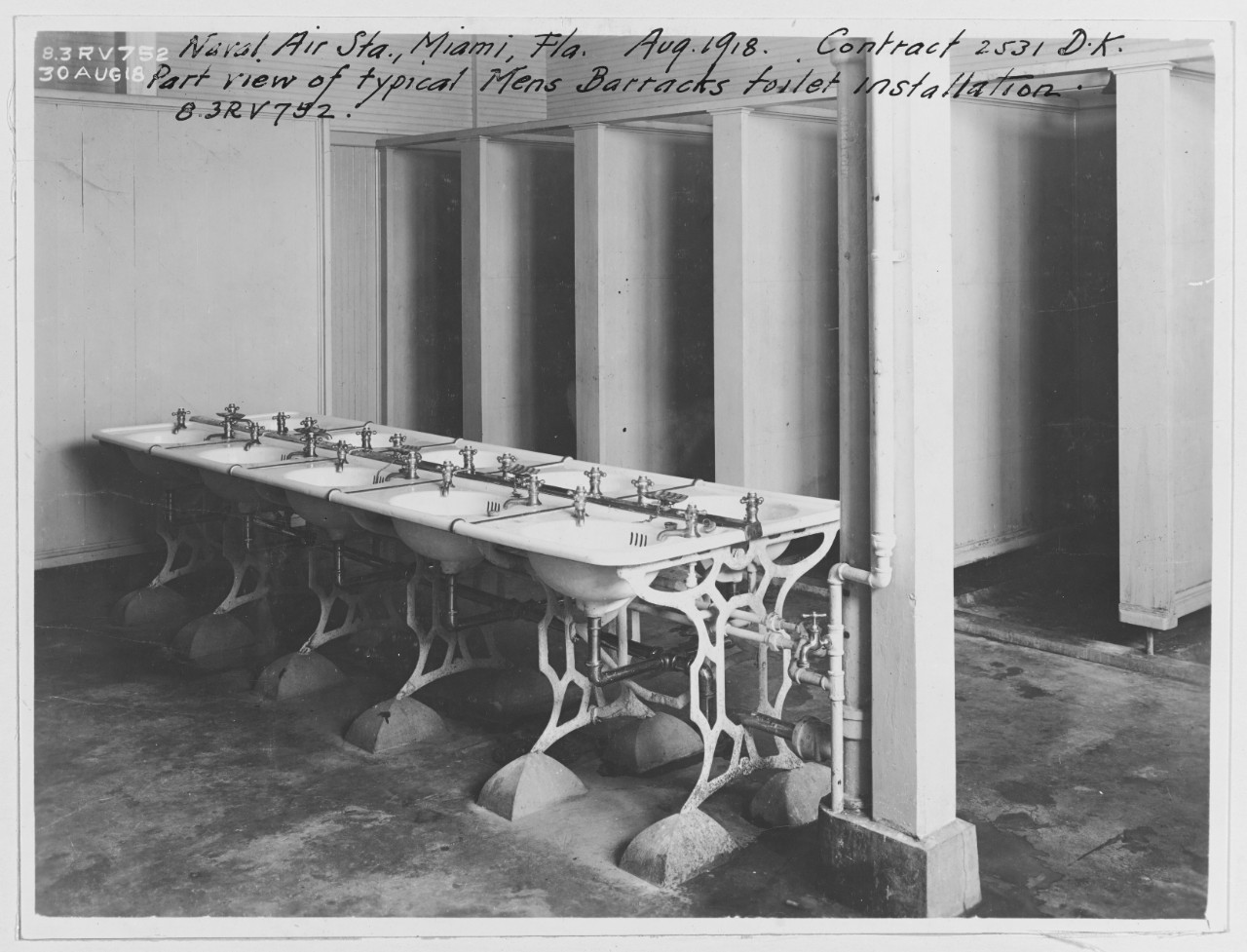Part view of typical Men's Barracks toilet installation. Naval Air Station Miami.