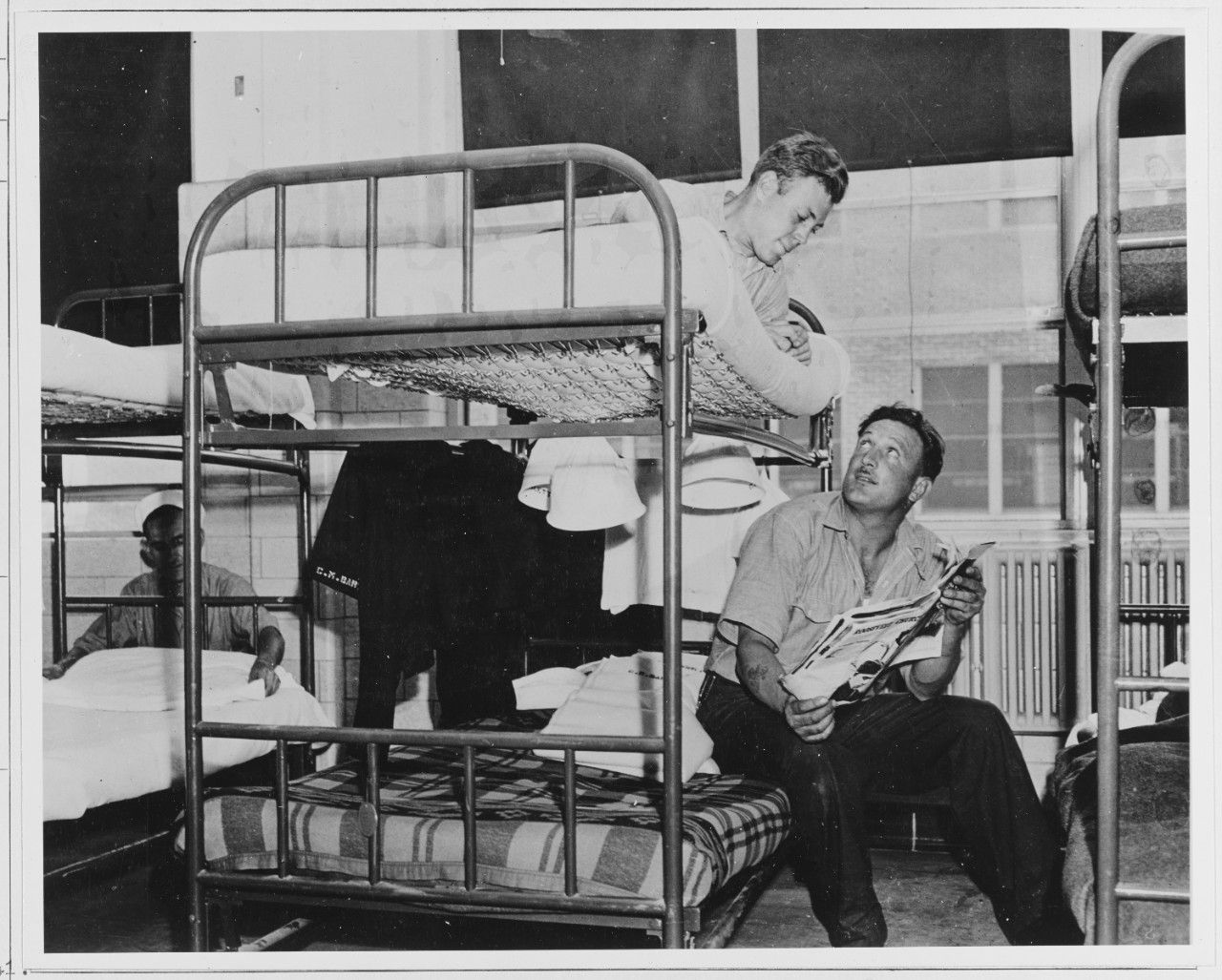 Enlisted men relaxing in barracks at Naval Air Station, Quonset Point, Rhode Island