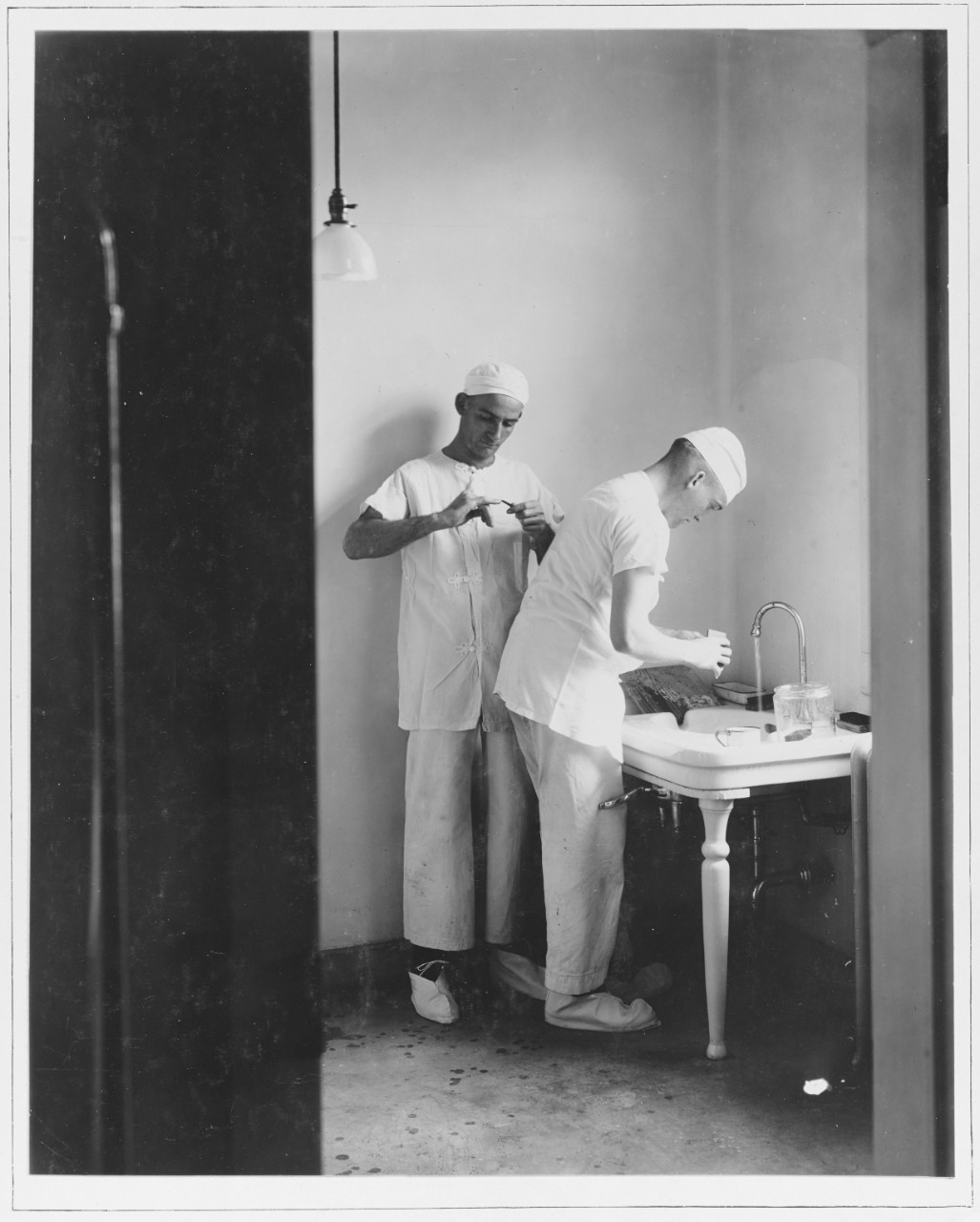 Disinfecting hands for surgical operation. U.S. Naval Hospital, New Orleans, Louisiana.