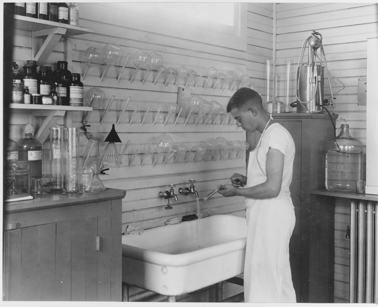 Cleaning test tubes in laboratory. U.S. Naval Hospital, New Orleans, Louisiana.