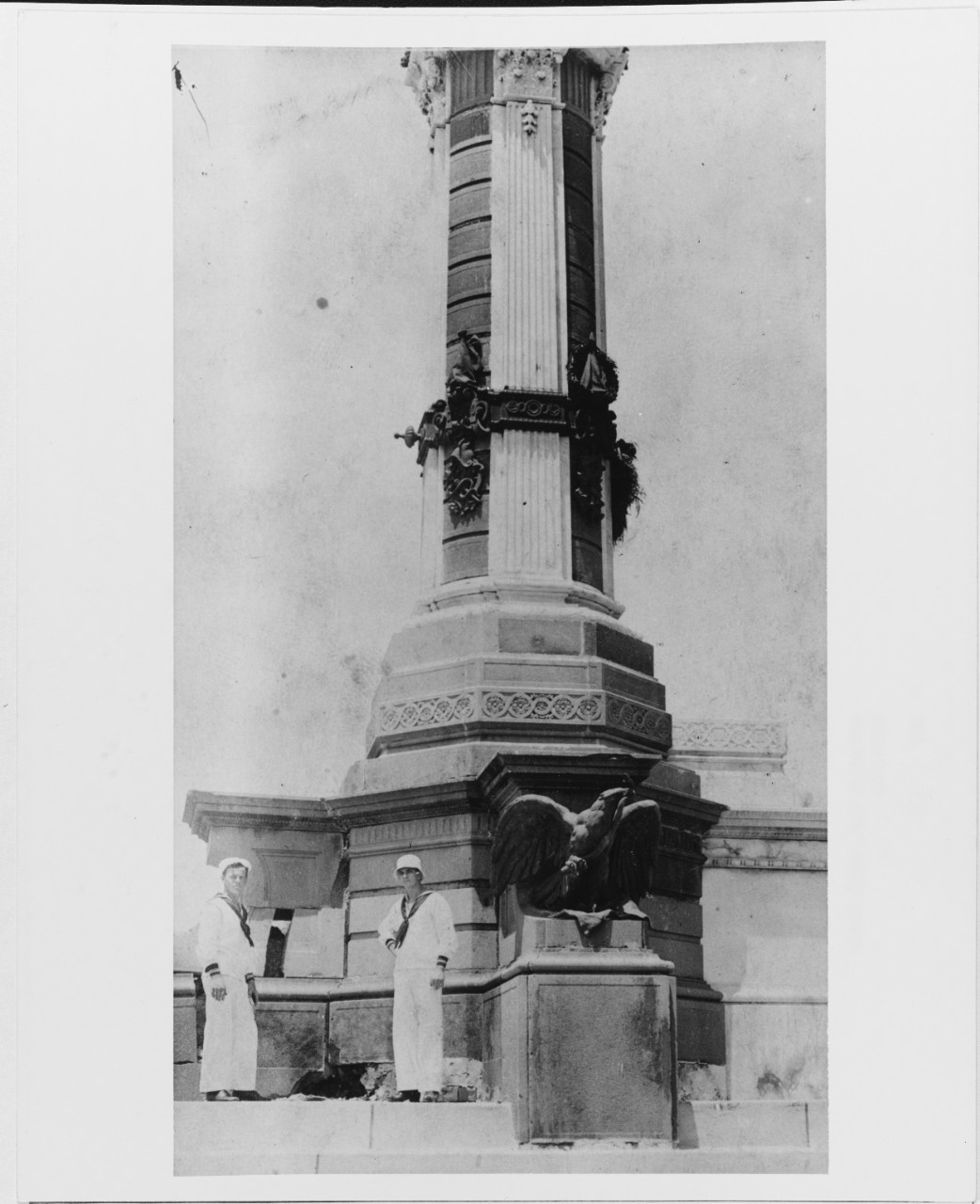 Sailors stand next to shell hit from Navy gun on a Monument in Vera Cruz, 1913