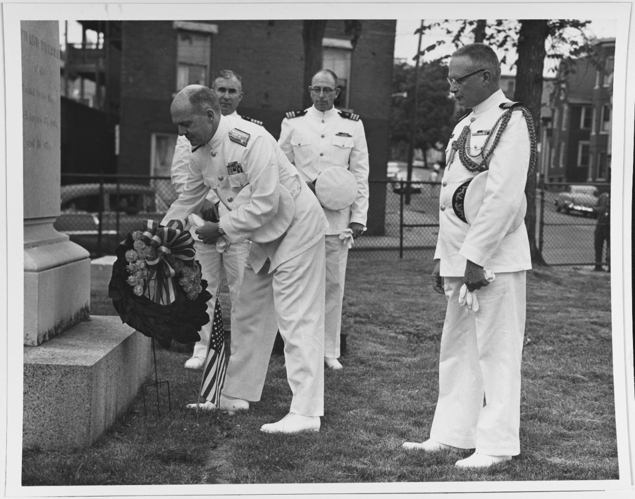 Vice Admiral Taylor placing a wreath on Commodore Edward Preble's grave. Captain Lloyd, Commander Forrestall and Captain Anderson. July 4, 1962