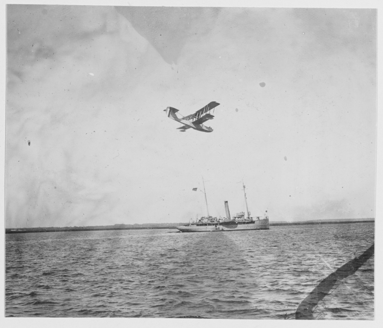 Seaplane flying over ship. Cape May (Sewells Point), New Jersey
