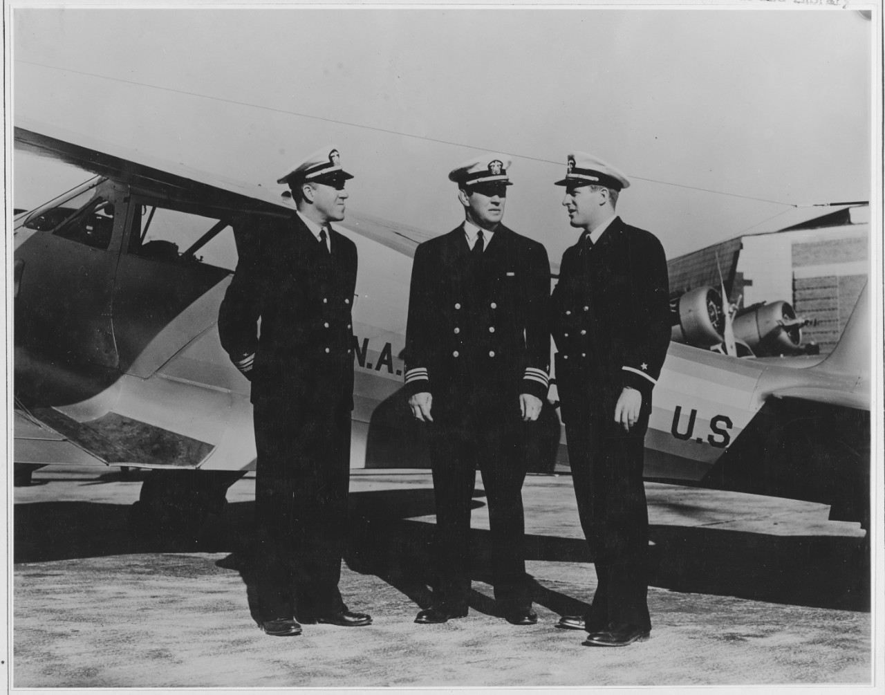 Comdr E.W. Mahan, Lt-Comdr J.J. Tunney and Ens J W Stack Tr. At the New Naval Air Station Pensacola Fla.