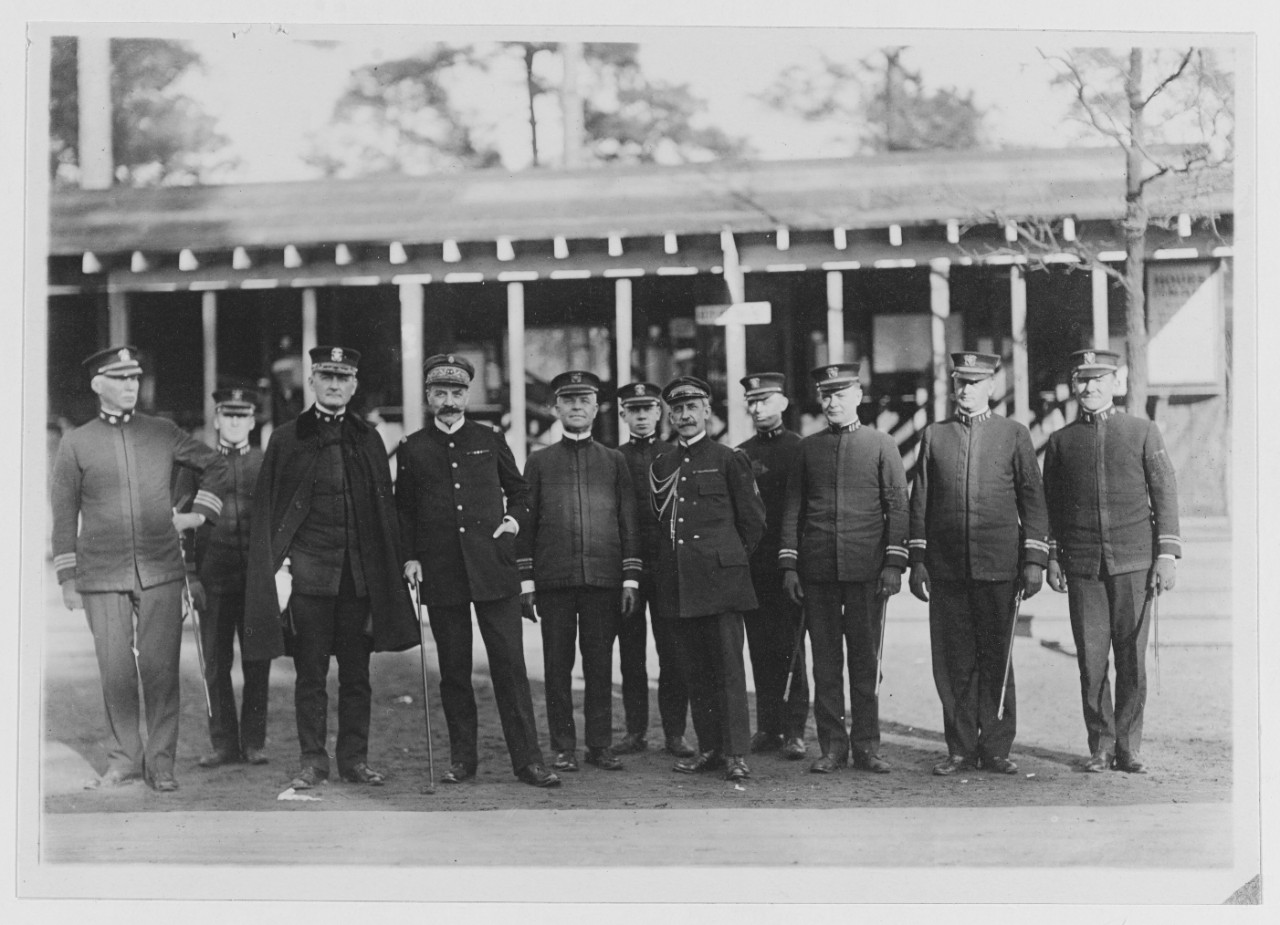 Allan Stuart, Comdr. Mark  St. Clair Ellis, Lt. Thompson, F. W. Ryan and other unidentified military officers. 1918