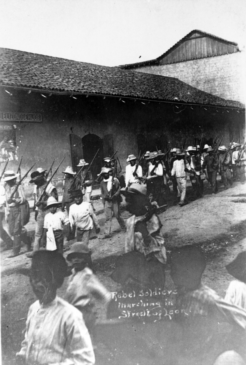 Rebel soldiers marching in the streets of Leon, Nicaragua, October 1912