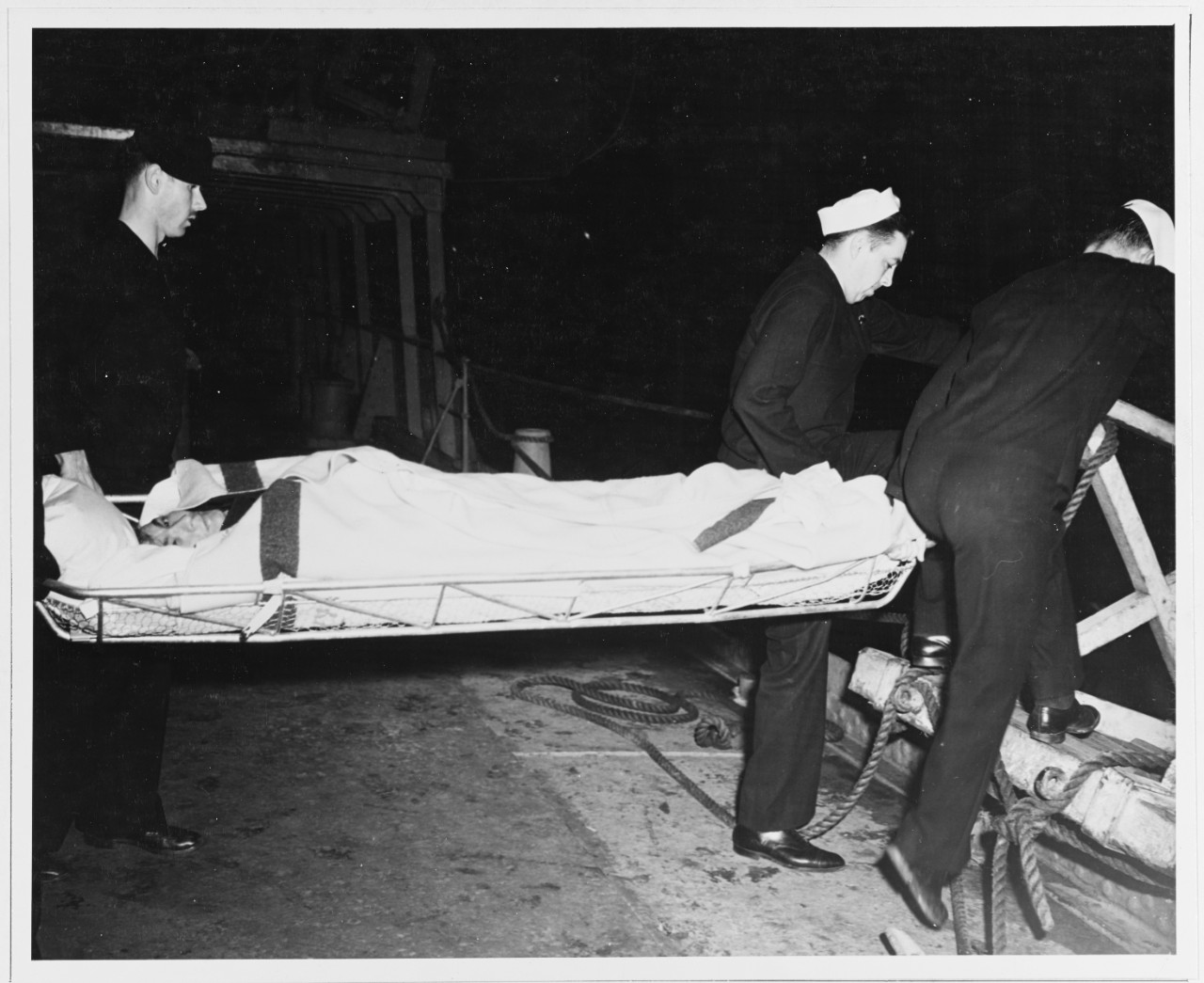 Survivor of the Brazilian ship "BUARQUE" carried on a stretcher