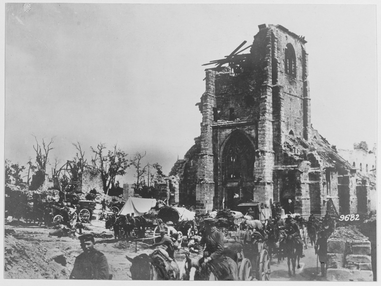 On the German West Front. German troops pass through the church square of Cormisy. World War I