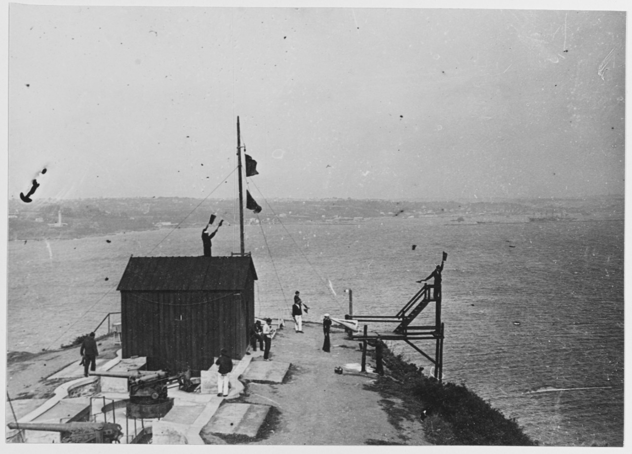 Signaling, men wave flags in the air. Brest, France, Point Espagnole, convoy reconnaissance post during World War I. September 25, 1918