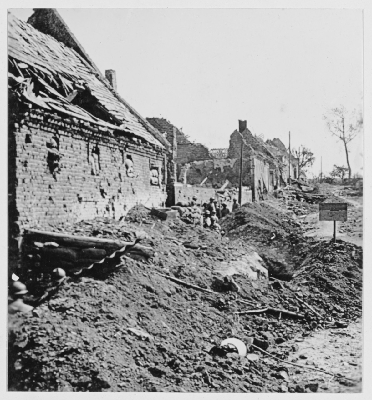 The Marne. Building with sandbags, men with helmets. France