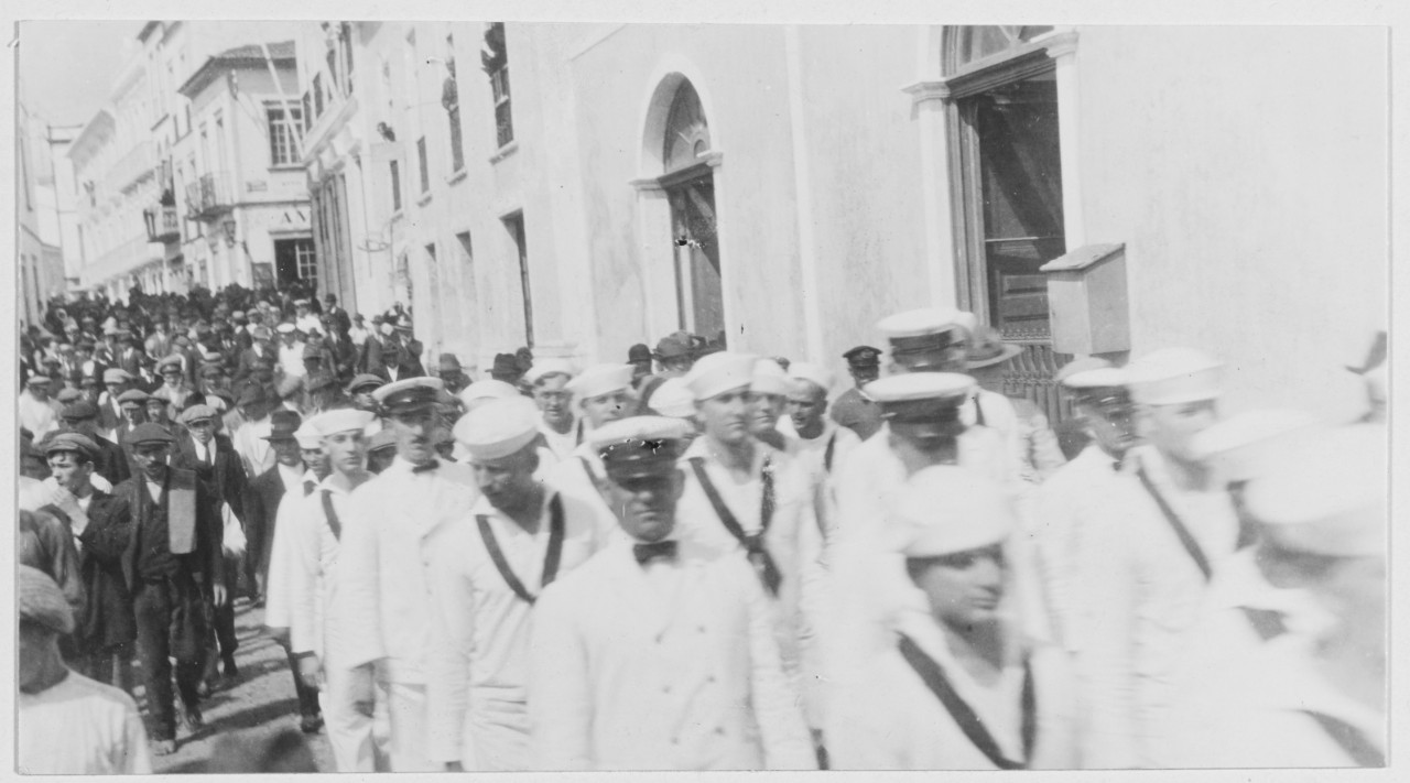 Personnel marching through streets of Ponta Delgada, Azores, Portugal, on way to embarkation pier