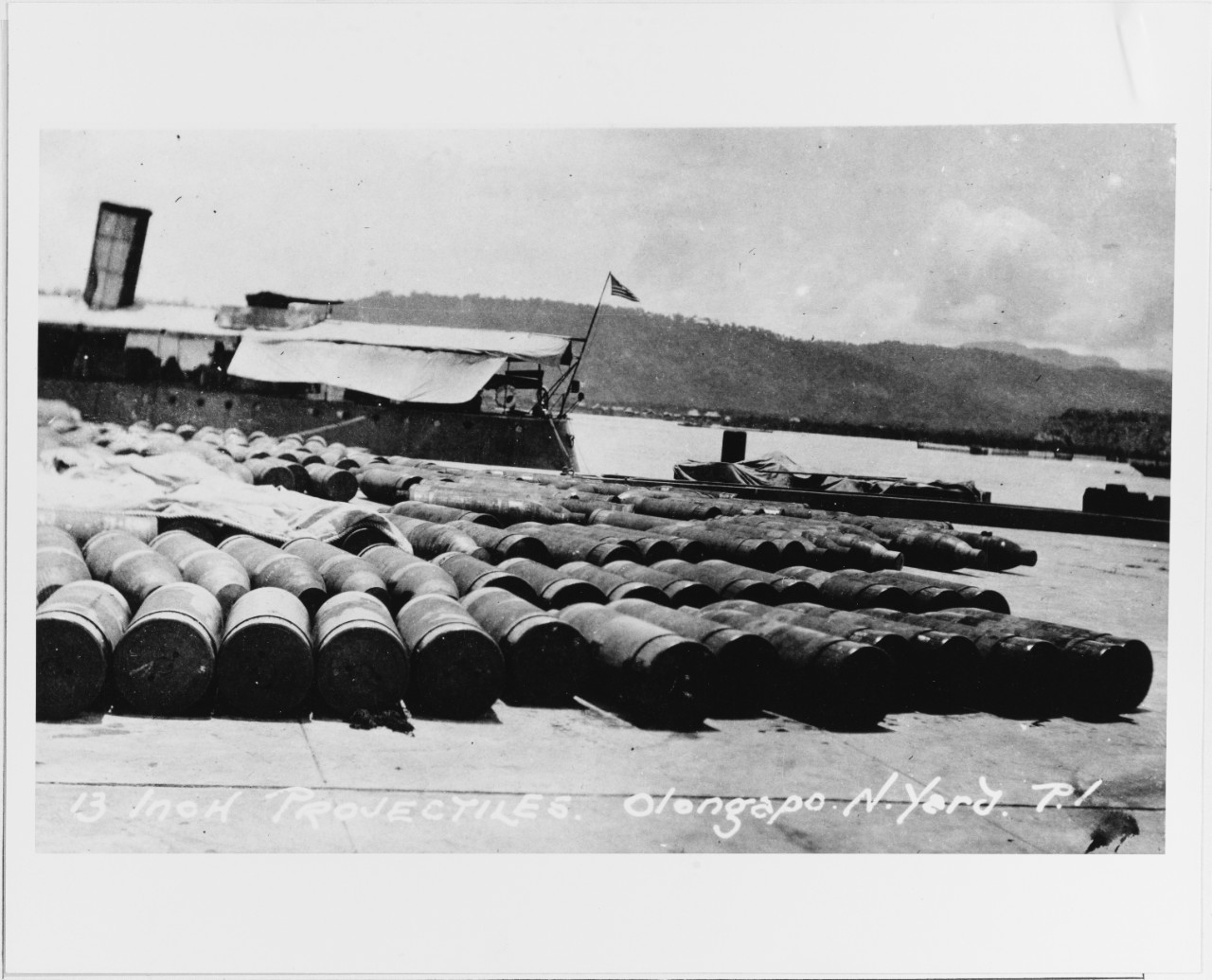 13 inch Projectiles stored dockside at Olongapo Navy Yard, Subic Bay, P.I. Post World War I