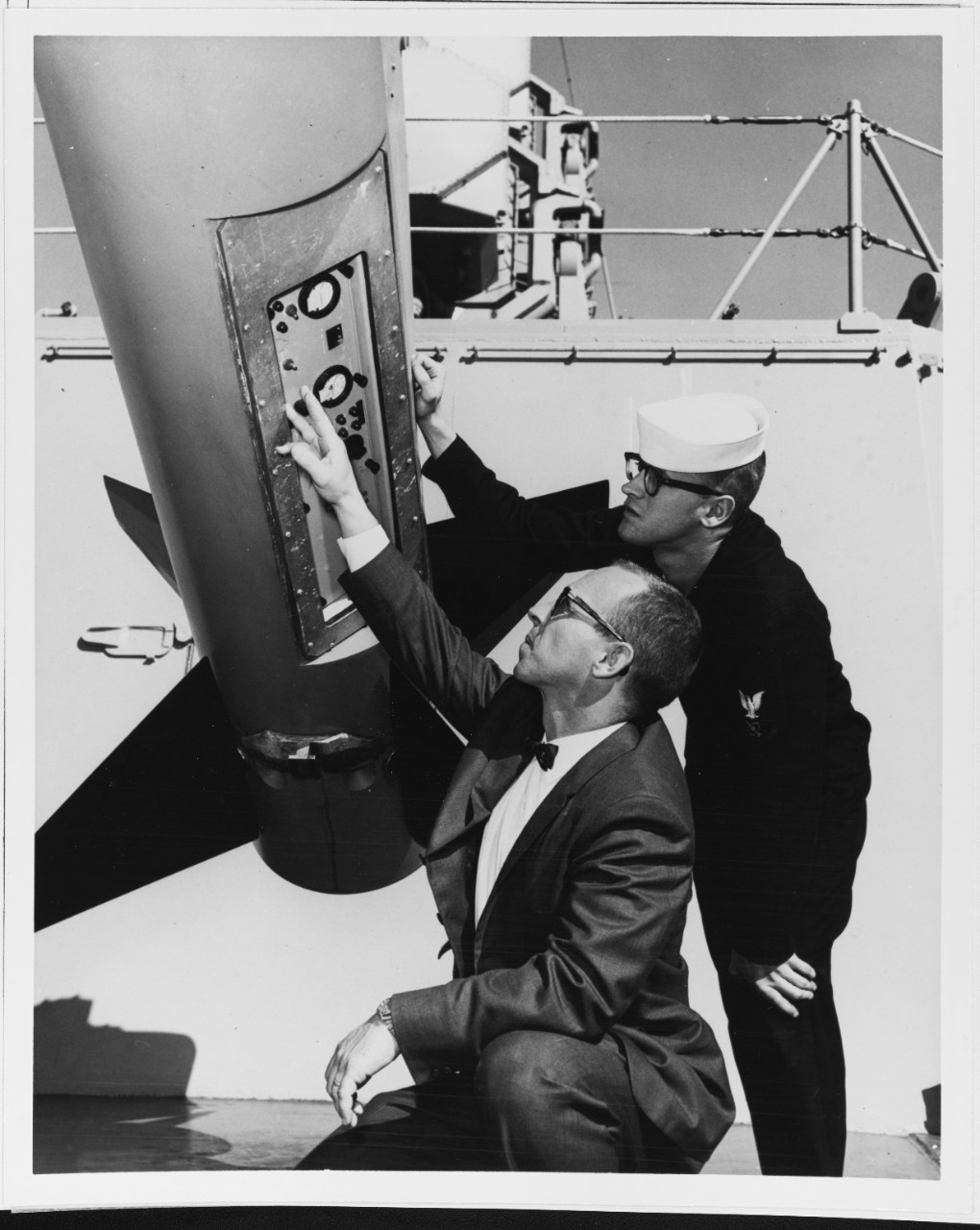 Men inspect Terrier Missile aboard DLG's tied up at San Diego Harbor, California. 5/19/1961