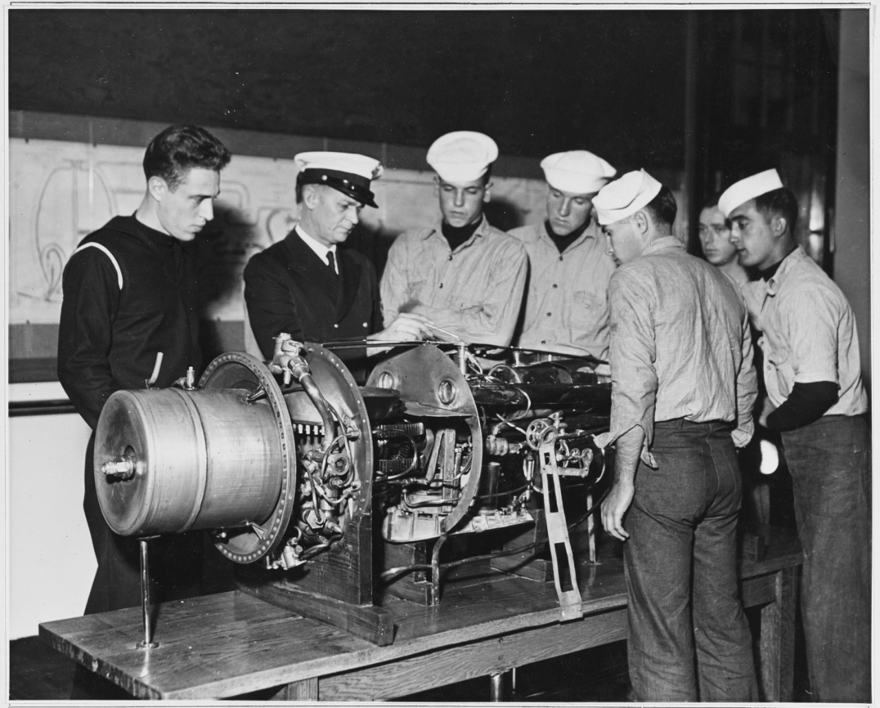 Men stand around a Torpedo. May 7, 1941